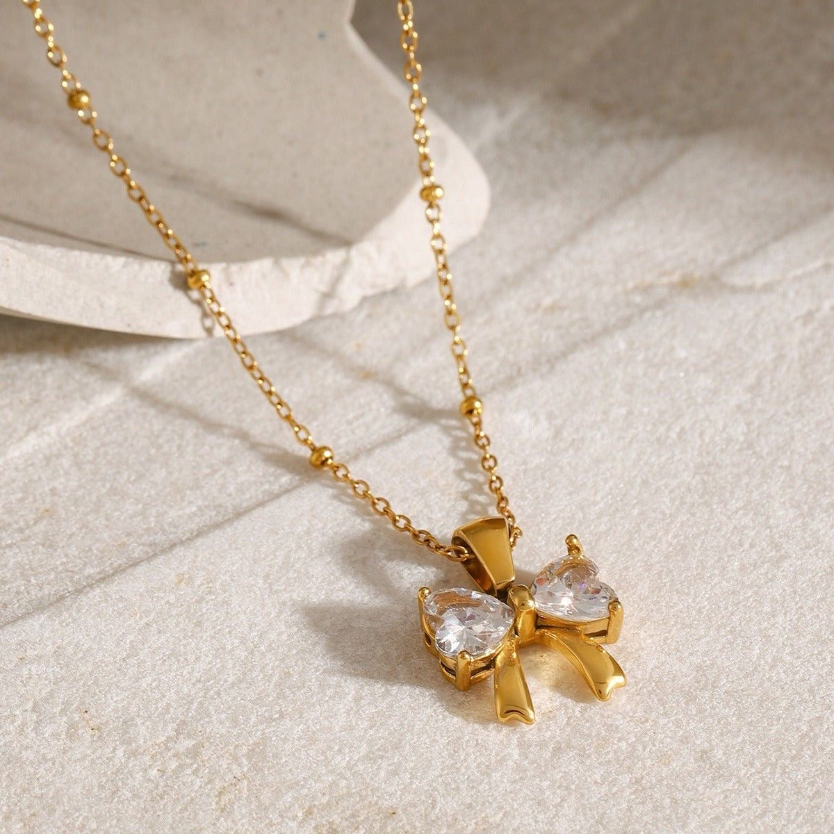 BOW SHINE NECKLACE